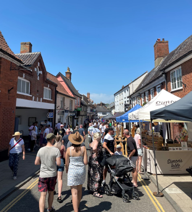 crowds in street browsing festival stalls