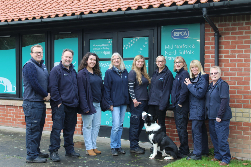 Group of RSPCA Staff outside their office with dog